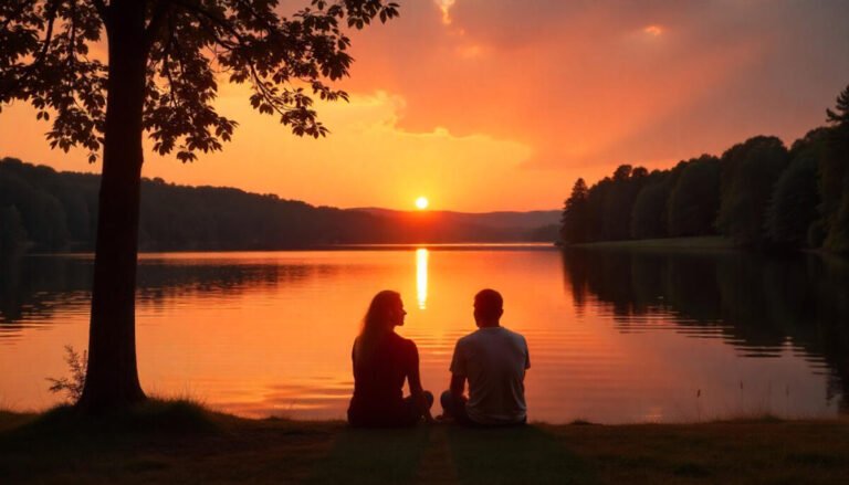 Romantic lakeside sunset in Pennsylvania with a couple sitting by the water, warm orange sky reflecting on the calm lake.