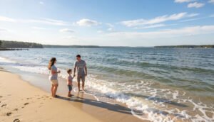 Family enjoying calm sandy Chesapeake Bay beach in Virginia with gentle waves and sunny sky